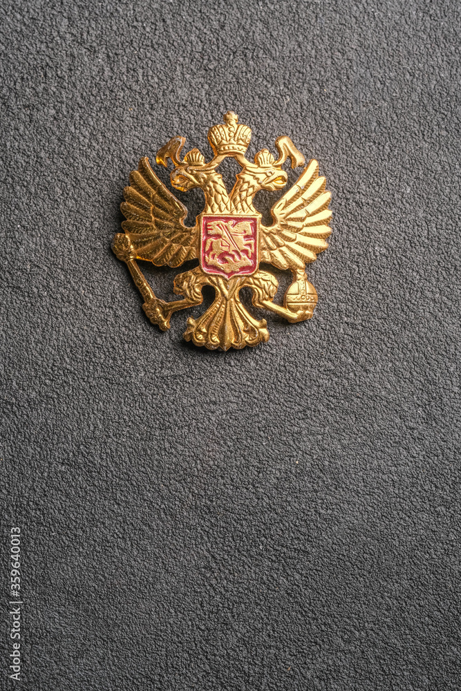 State emblem of Russia on a grey neutral background. Double-headed eagle, Russian coat of arms. Free space for placing text. State emblem of Russia on a grey neutral background. Double-headed eagle, Russian coat of arms. Free space for placing text.