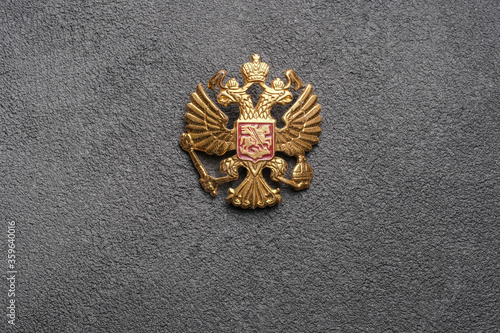 State emblem of Russia on a grey neutral background. Double-headed eagle, Russian coat of arms. Free space for placing text.