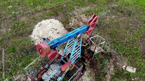 Oil pump jack rocking. Rocking machines for power generation. Extraction of oil. Aerial view.