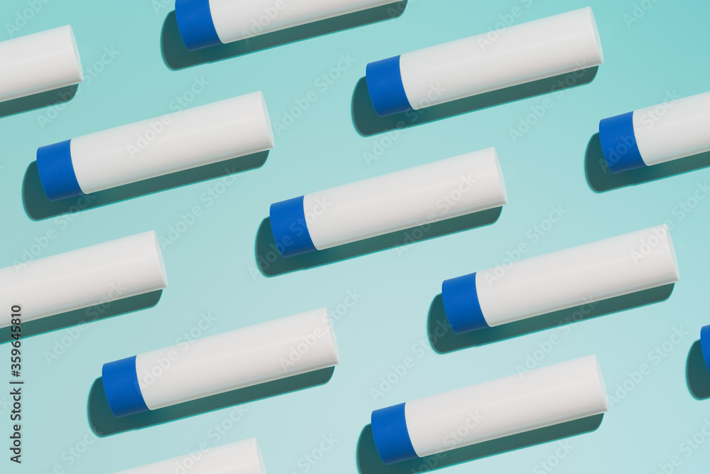 Hygienic lipstick on empty blue background Hygienic lipstick on empty blue background