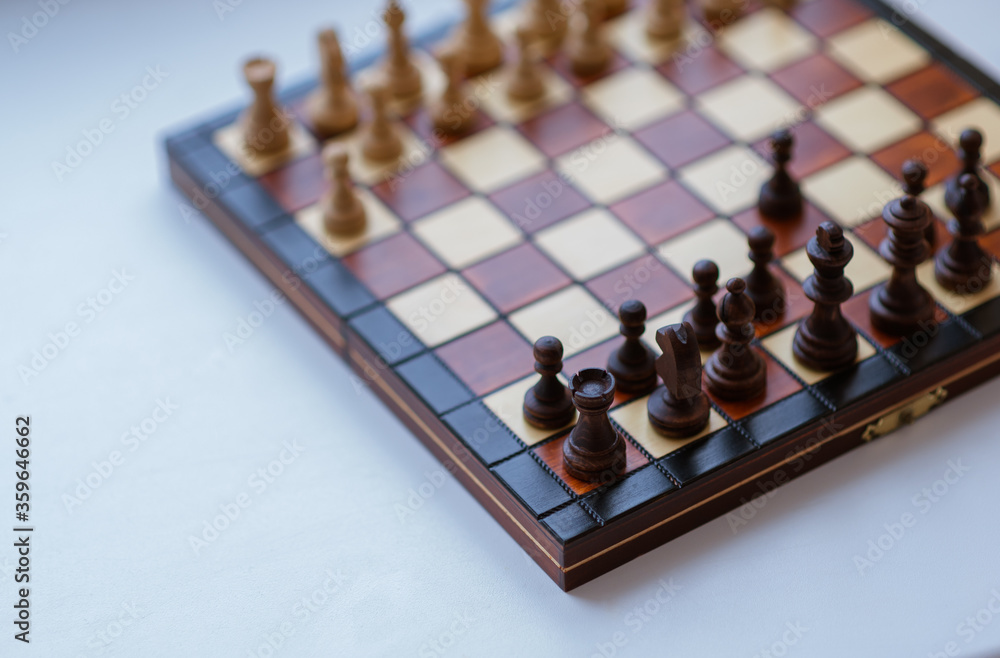 Strategic moves, a game of chess. Cropped view of a chessboard. International chess day. Strategic moves, a game of chess. Cropped view of a chessboard. International chess day.