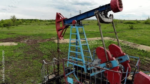 Oil pump jack rocking. Rocking machines for power generation. Extraction of oil. Aerial view.