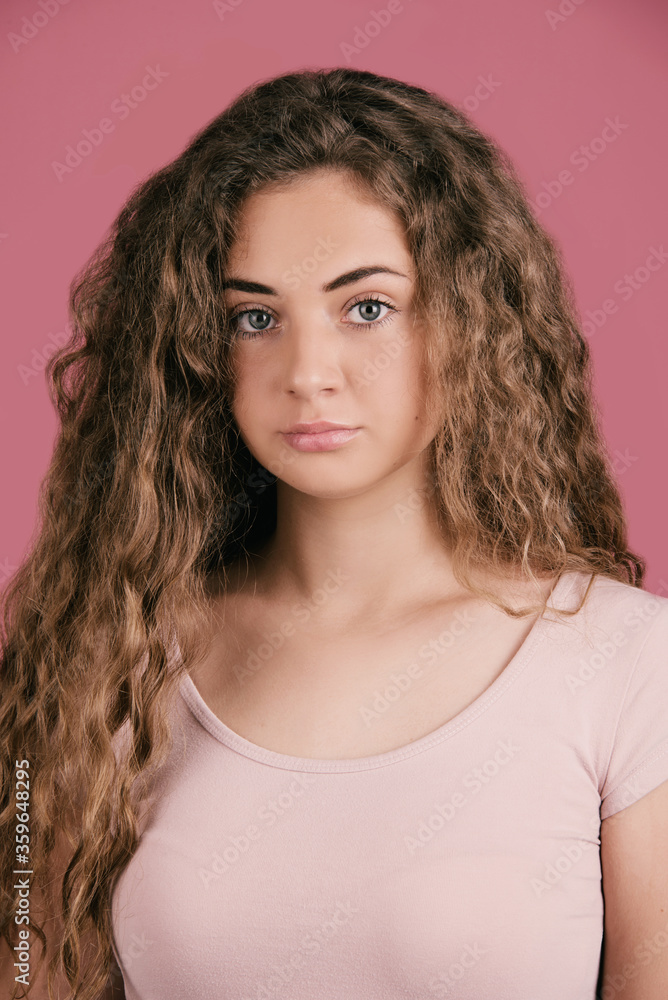 Portrait of Caucasian teenage girl, close up, isolated on white with long hair and big blue eyes Portrait of Caucasian teenage girl, close up, isolated on white with long hair and big blue eyes