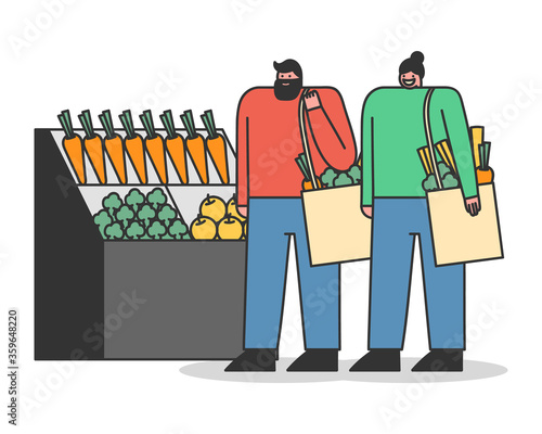 People carrying shopping eco bags with purchases in shop. Zero waste concept