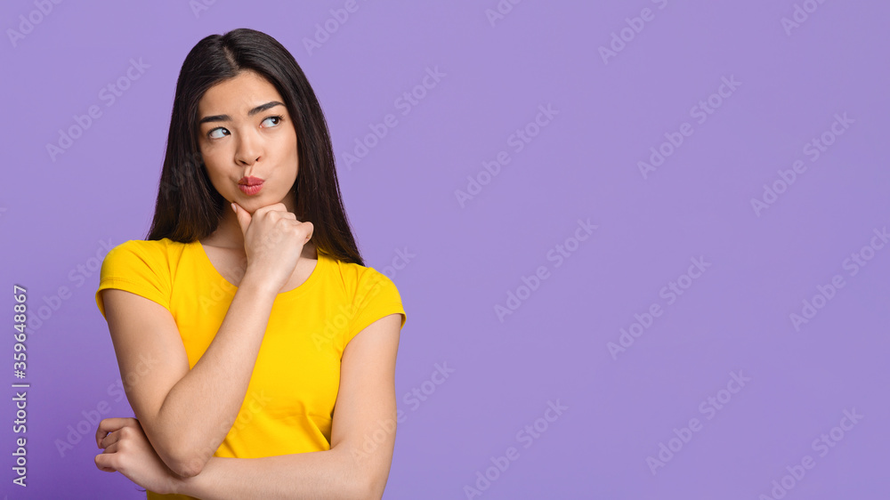 Doubtful Choice. Pensive Asian Woman Touching Ching And Looking At Copy Space Doubtful Choice. Pensive Asian Woman Touching Ching And Looking At Copy Space