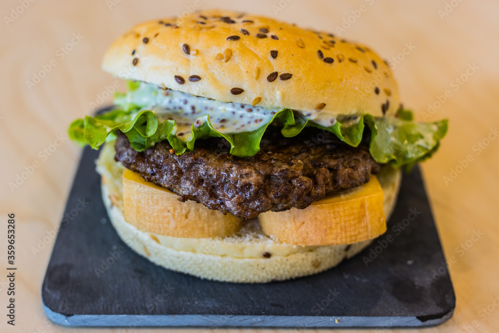 beef burger, cheese, tomatoes, salad