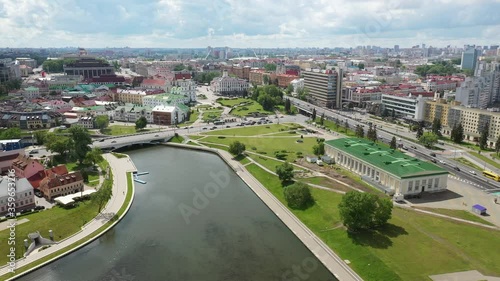 Minsk city landscape in the summer, Belarus. Aerial view of Nemiga. View at island of Tears memorial, Traetskae Pradmestse (Trinity Suburb) and upper town in Minsk.
 photo