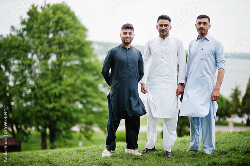 Group of pakistani man wearing traditional clothes salwar kameez or kurta.