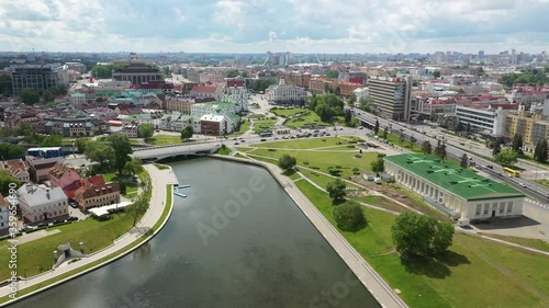 Minsk city landscape in the summer, Belarus. Aerial view of Nemiga. View at island of Tears memorial, Traetskae Pradmestse (Trinity Suburb) and upper town in Minsk.
 photo