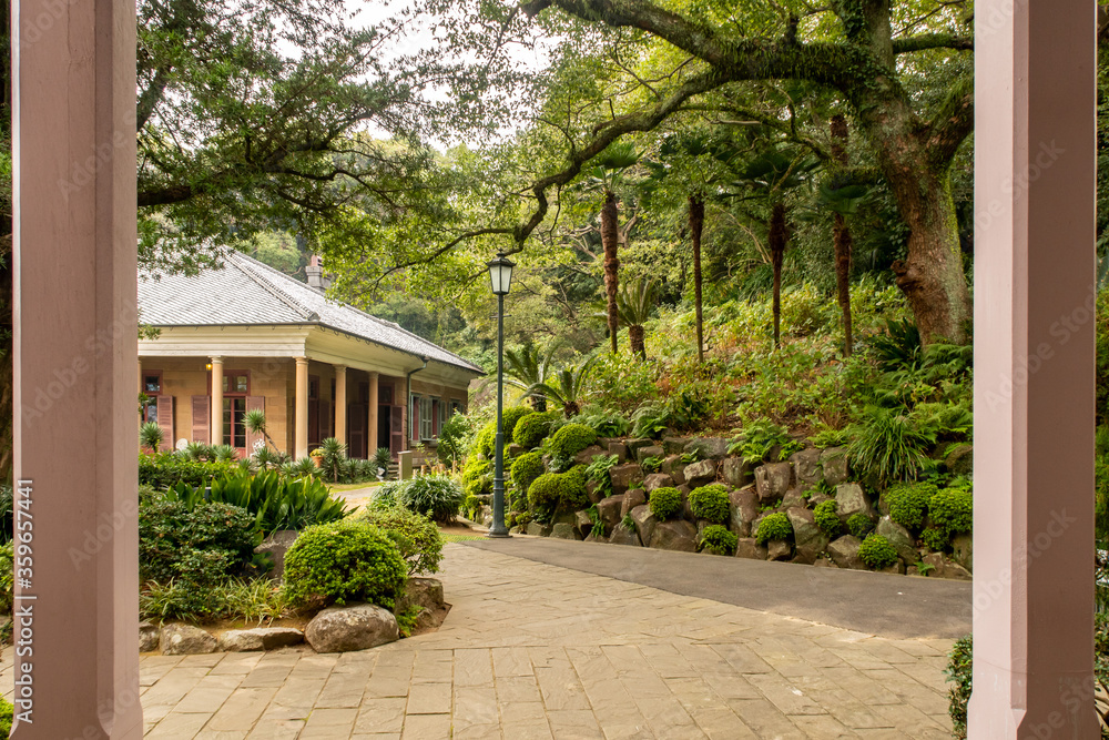 Colonial style pink columns and european old buildings in Glover Garden japanese park in Nagasaki, Japan.