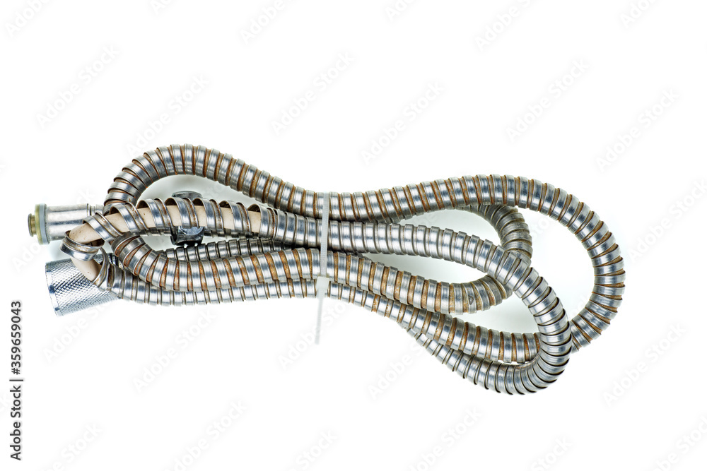 Old damaged shower hose isolated on a white background