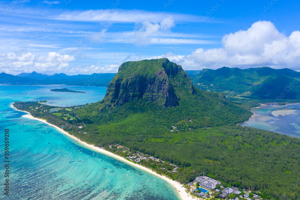 Aerial view of Le Morne Brabant, a UNESCO world heritage site.Coral reef of the island of Mauritius. panorama underwater waterfall