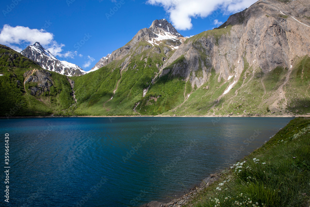 Obraz premium Morasco Lake (VCO), Italy - June 21, 2020: The landscape and Morasco Lake, Morasco Lake, Formazza Valley, Ossola Valley, VCO, Piedmont, Italy