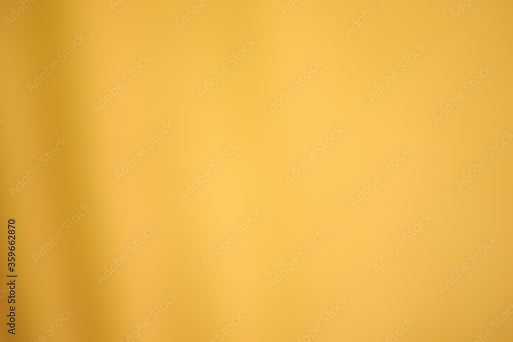 Obraz premium Golden yellow cotton fabric for a soft and smooth background. Elegant graphics.