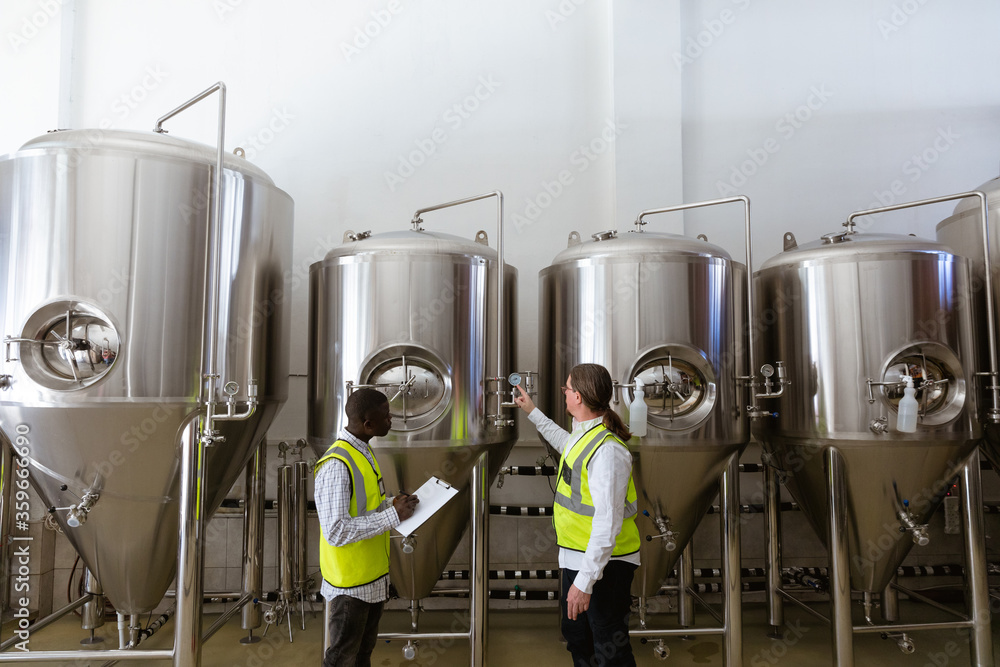 Men working in brewery Men working in brewery