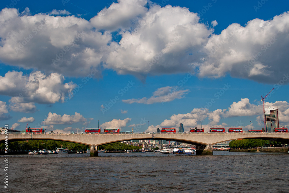 Red London transport buses on Waterloo Bridge on the River Thames London United Kingdom Red London transport buses on Waterloo Bridge on the River Thames London United Kingdom