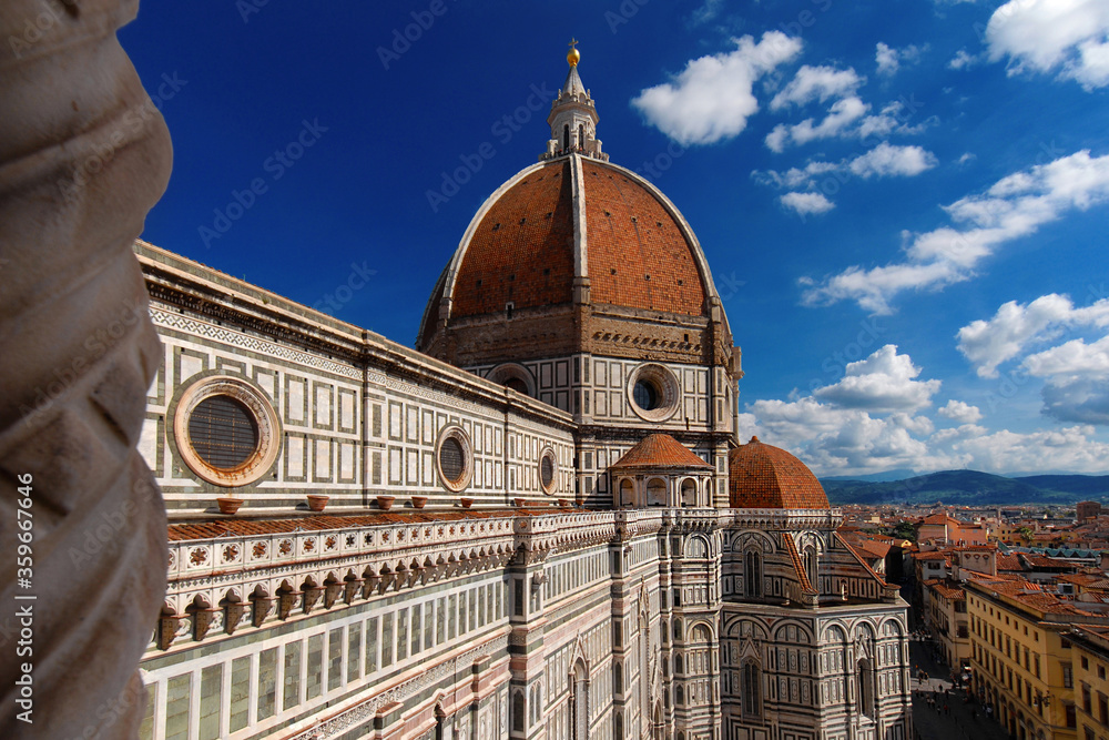 View of wonderful dome of Santa Maria del Fiore (St Mary of the Flower) in Florence with tourists at the top, built by italian architect Brunelleschi in the 15th century, a symbol of Renaissance in th