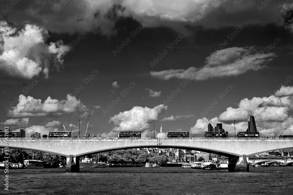 Red London transport buses on Waterloo Bridge on the River Thames London United Kingdom Red London transport buses on Waterloo Bridge on the River Thames London United Kingdom