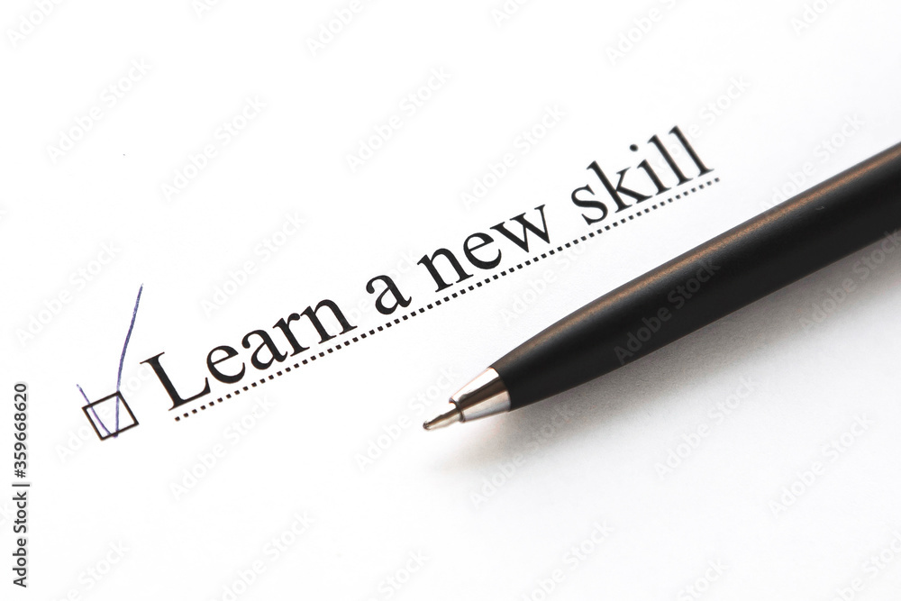 a piece of paper with the inscription learn a new skill from to do list with a tick a piece of paper with the inscription learn a new skill from to do list with a tick