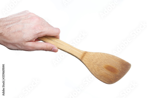 man hand holding kitchen utensil on white background