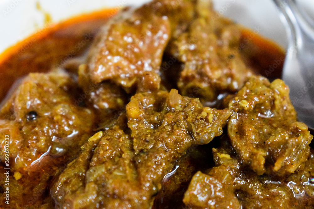 South Indian cuisine Kerala Style Beef curry / roast. Traditional style meat curry. Indian spicy curry. Selective focus photograph. South Indian cuisine Kerala Style Beef curry / roast. Traditional style meat curry. Indian spicy curry. Selective focus photograph.