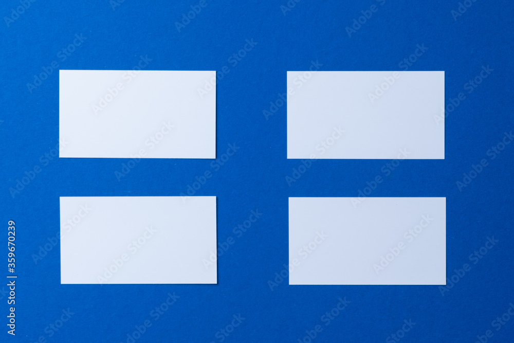 Blank paper business mock up on classic blue background