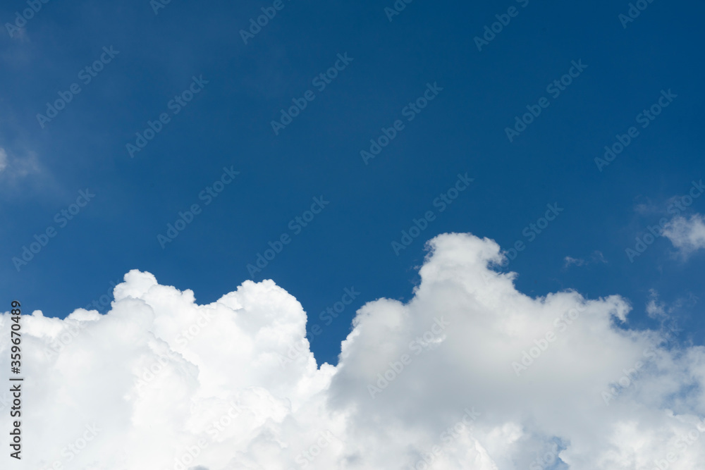 Clean white clouds below In the blue sky Clean white clouds below In the blue sky