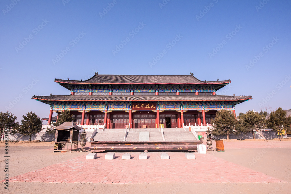 Qian'an City, Hebei Province, China - December 1, 2018: ancient buildings, Buddha statues, door god sculptures and stone archways of Chinese temples. Qian'an City, Hebei Province, China - December 1, 2018: ancient buildings, Buddha statues, door god sculptures and stone archways of Chinese temples.