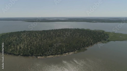 View from above on the coastal forest tundra. River and islands with taiga. photo