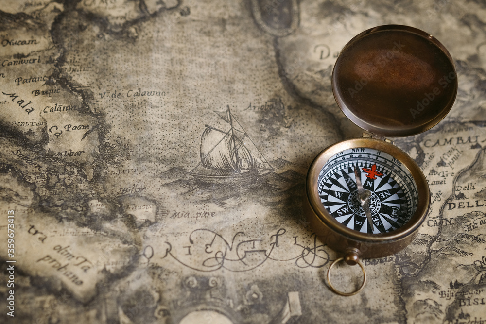 old compass on old map