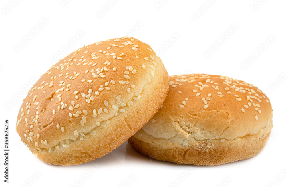 sesame buns for hot dogs on a white isolated background, close-up