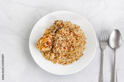One Pot Mediterranean Chicken Rice on a Plate on White Background Top Down Food Photography