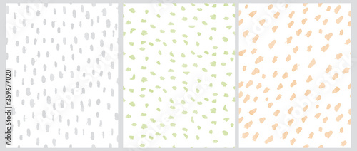 Cute Geometric Seamless Vector Patterns. Pastel Green, Yellow and Light Gray Free Hand Spatters Isolated on a White Background. Simple Abstract Vector Prints. Watercolor Style Brush Spots. Scribbles B