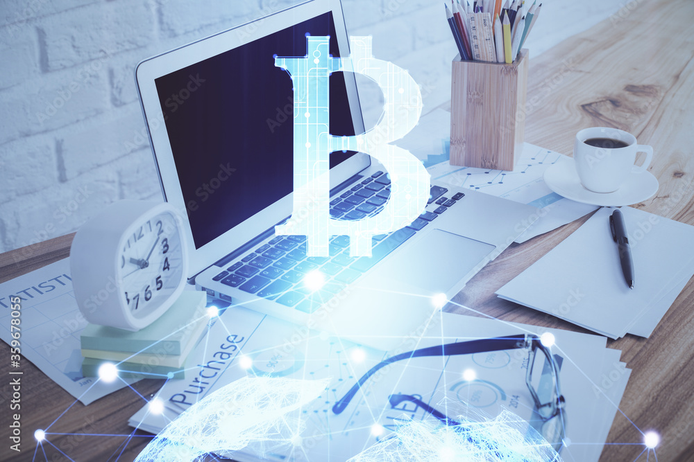 Double exposure of blockchain and crypto economy theme hologram and table with computer background. Concept of bitcoin cryptocurrency. Double exposure of blockchain and crypto economy theme hologram and table with computer background. Concept of bitcoin cryptocurrency.