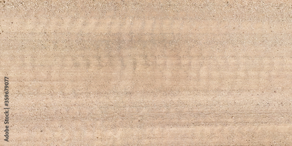 view from above on texture of gravel road with car tire tracks view from above on texture of gravel road with car tire tracks
