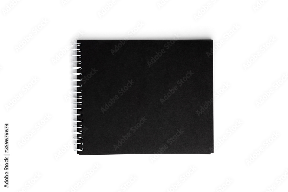 Black notebook isolated on white background.
