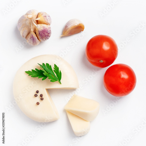 Сheese and spices on white. Food background. Top view.