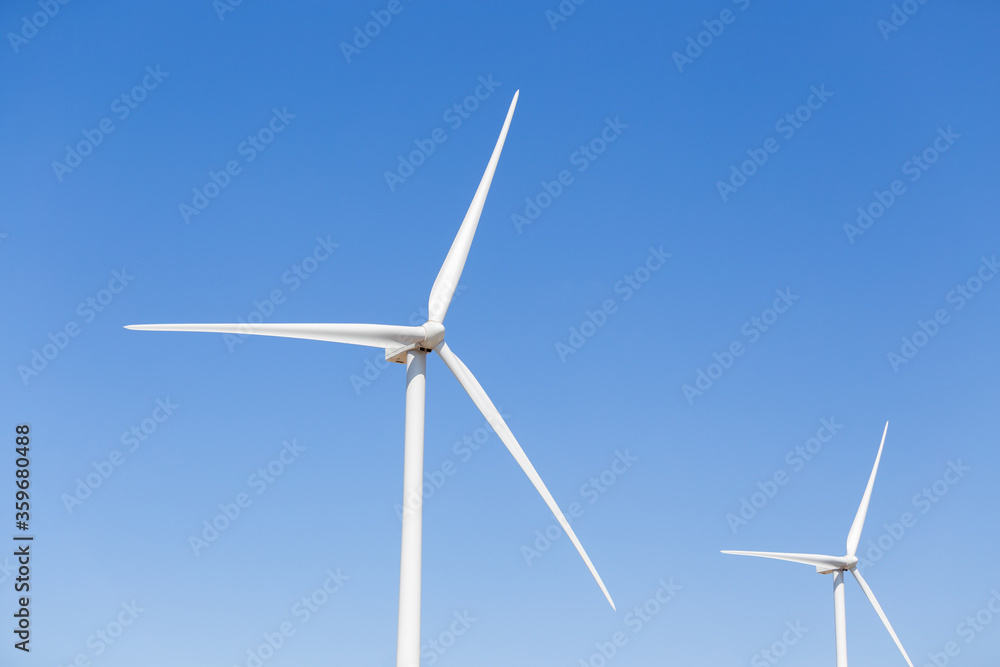 Propellers of the wind generator against blue sky Propellers of the wind generator against blue sky