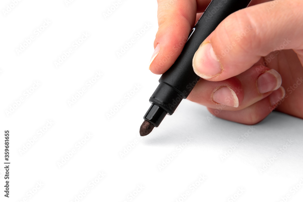 Black marker in hand isolated on white background. Black marker in hand isolated on white background.