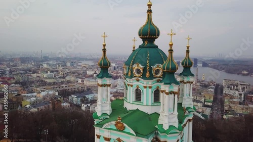 St Andrew's Church, ukrainian baroque architecture with Podil district, old town on background photo