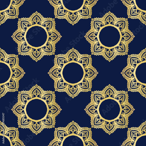 Gold navy blu foil medallion texture seamless background. Metallic golden ornate decorative ogee motif. Elegant floral shine ornament pattern. Festive winter party bling wallpaper all over print.