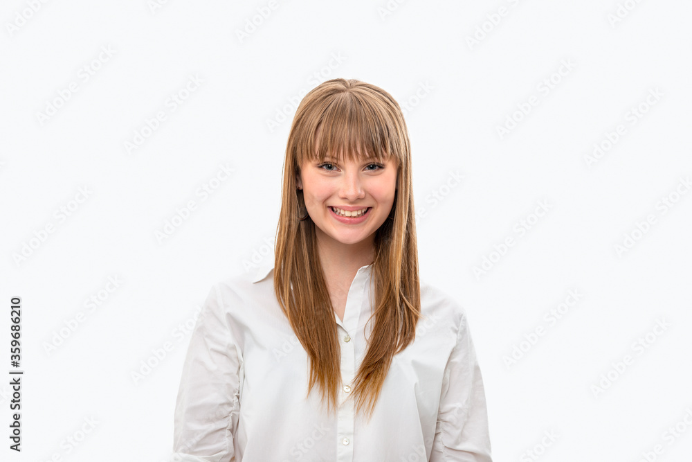 Studio shot of an attractive teenager girl with long hair and bangs wearing white shirt, isolated Studio shot of an attractive teenager girl with long hair and bangs wearing white shirt, isolated