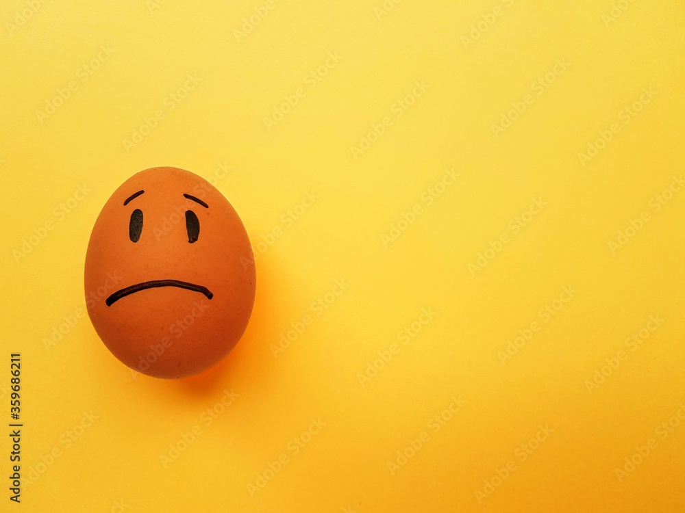 Fototapeta premium Chicken yellow eggs on a bright yellow background. Space for text.