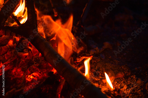 fire  flame  heat  wood  burn  fireplace  hot  bonfire  flames  campfire  burning  red  orange  warm  camp  night  light  camping  coal  black  yellow  barbecue  blaze  danger  ember