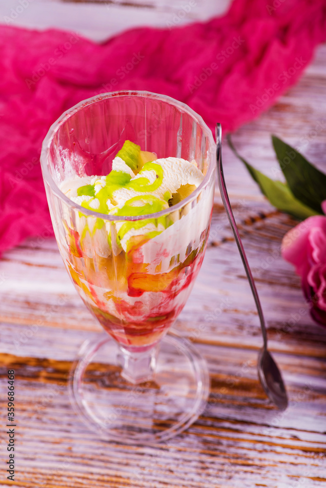 milk fruit dessert souffle mousse with pieces of jelly in a beautiful glass on a leg on a white background
ice cream in a beautiful glass but on a wooden background milk fruit dessert souffle mousse with pieces of jelly in a beautiful glass on a leg on a white background
ice cream in a beautiful glass but on a wooden background