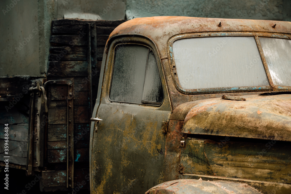old rusty car, wrecked automobile in the parking lot old rusty car, wrecked automobile in the parking lot