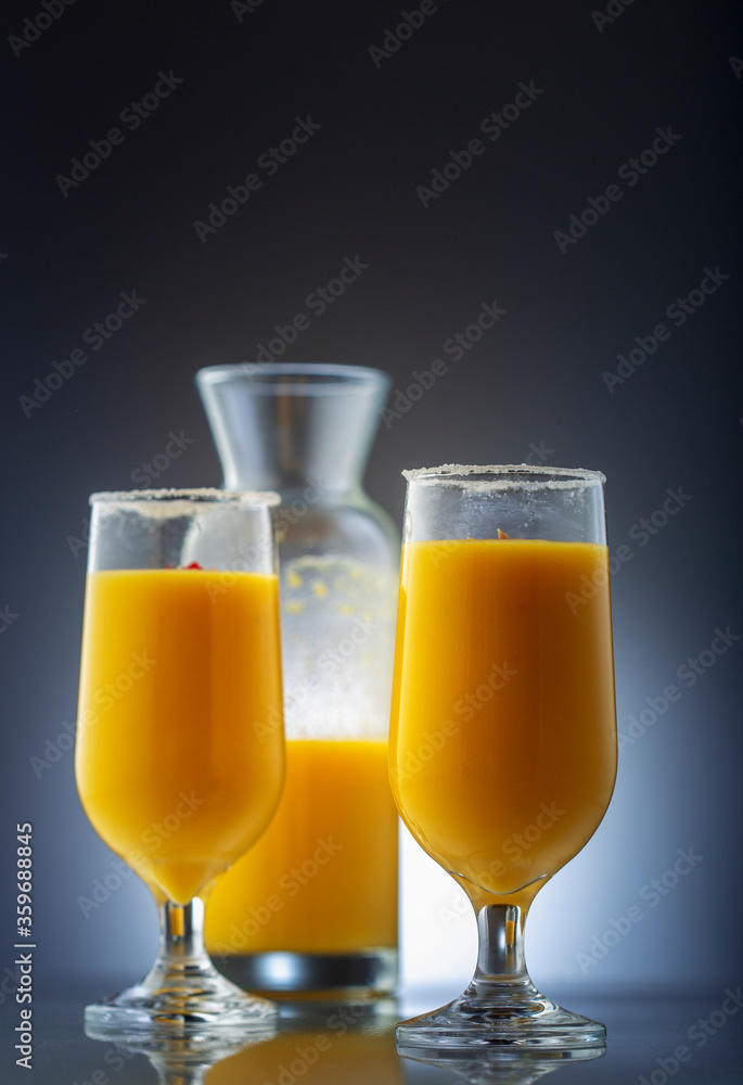 mango smoothie in clear glasses to drink