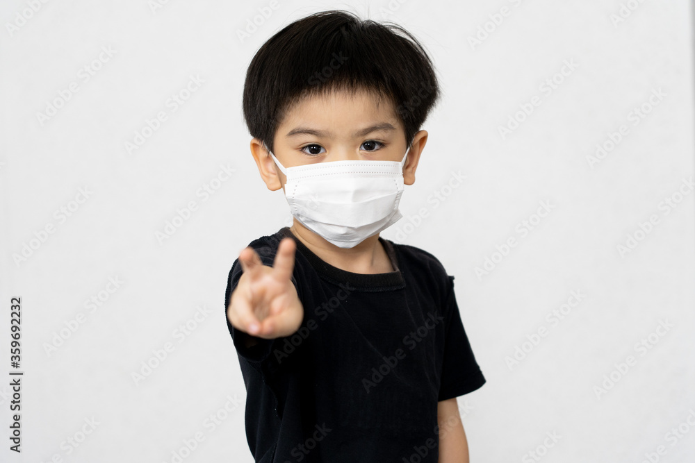 Asian boy waring mask for protect corona virus. Asian boy waring mask for protect corona virus.