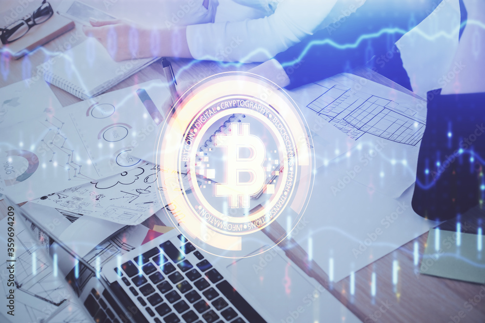 Cryptocurrency hologram over woman's hands writing background. Concept of blockchain. Multi exposure Cryptocurrency hologram over woman's hands writing background. Concept of blockchain. Multi exposure