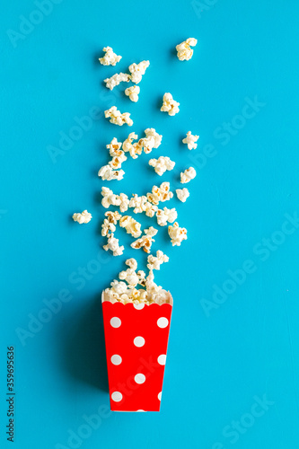 Popcorn in red dotted paper cup top-down